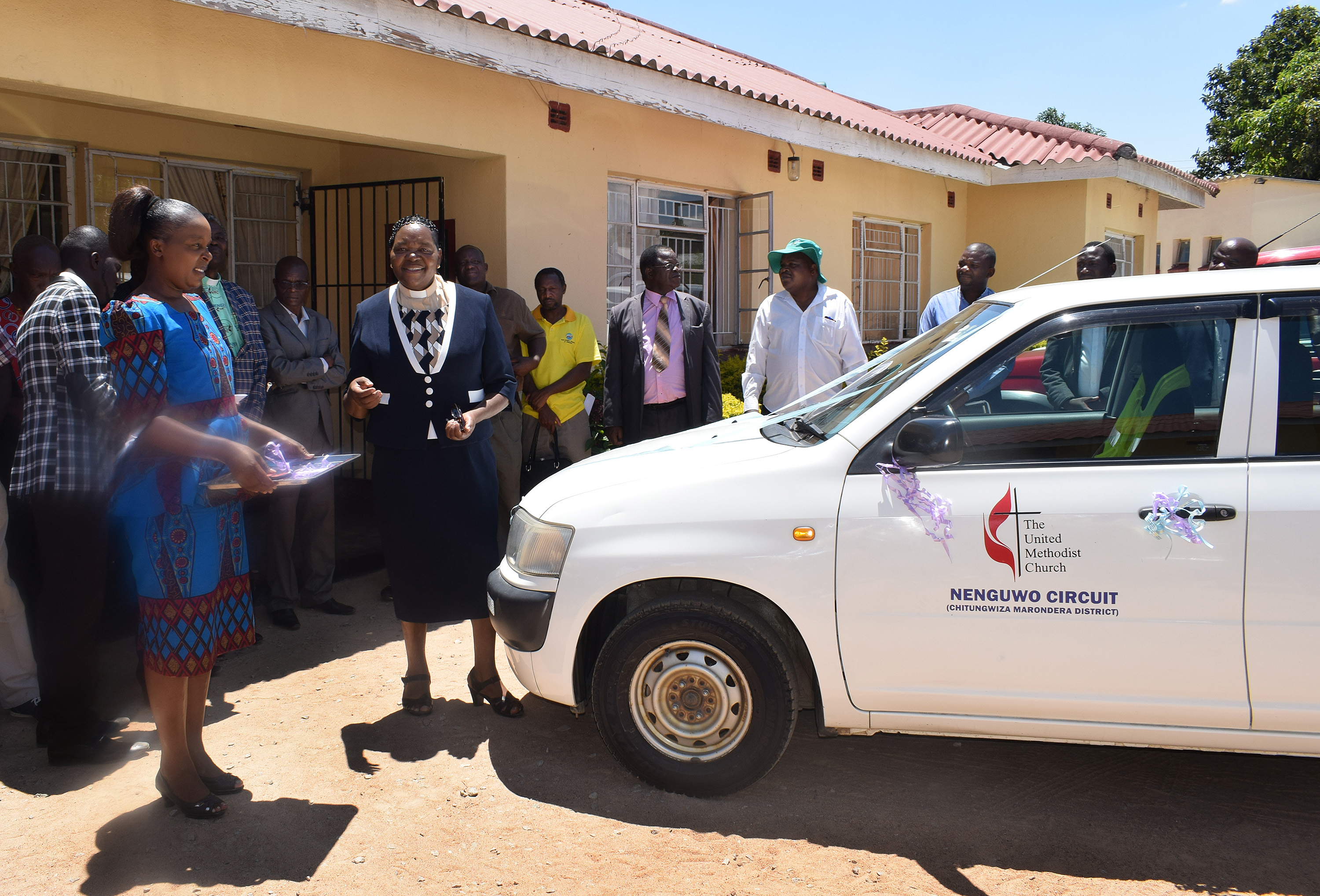 Church members and leaders celebrate the purchase of a car for use by United Methodist pastors in the Nenguwo Circuit outside Harare, Zimbabwe. Photo by Eveline Chikwanah.