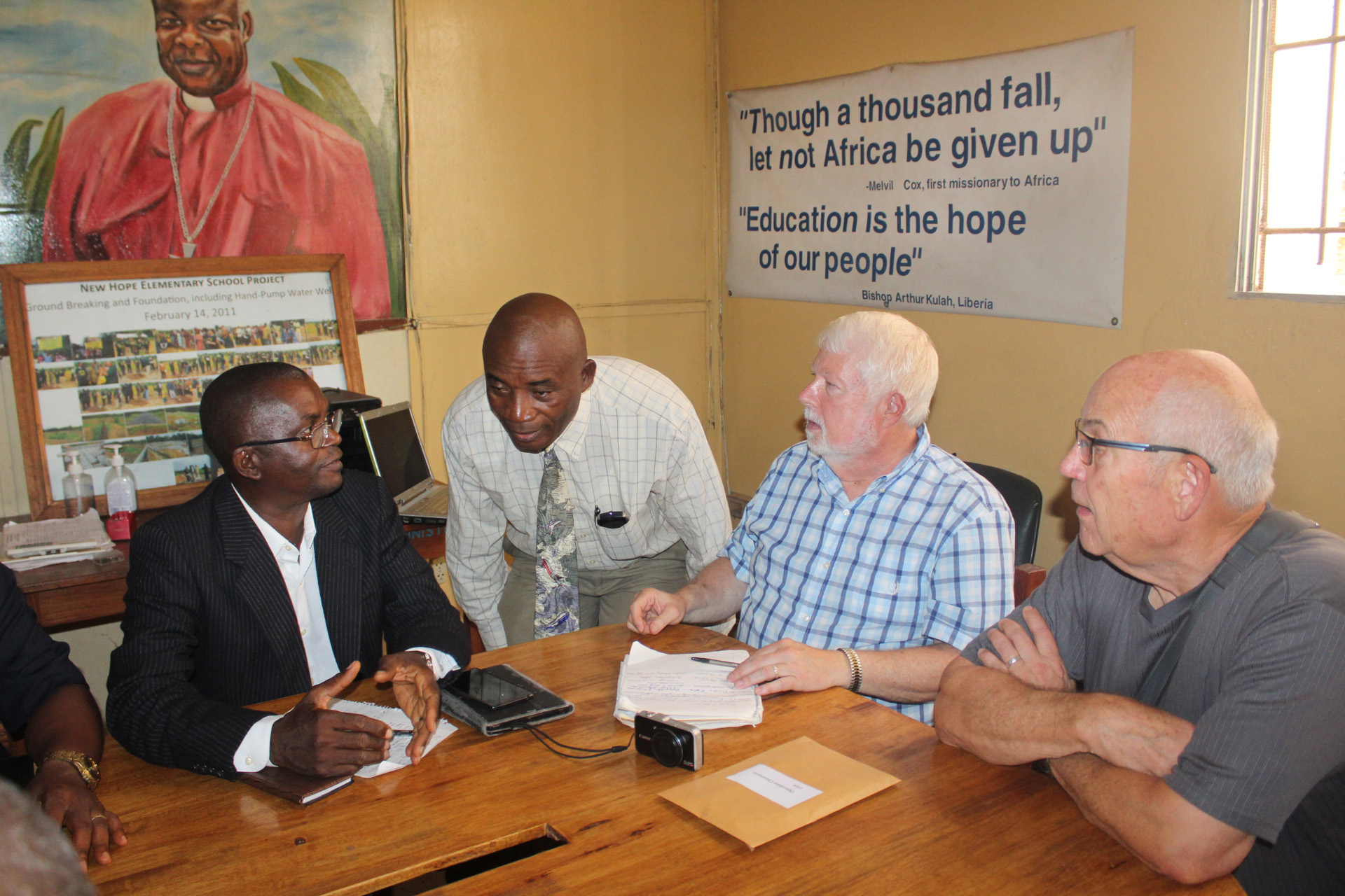 United Methodist school directors from Liberia and Sierra Leone and leaders from Operation Classroom meet in Monrovia, Liberia. (From left) Joseph Pormai with The United Methodist Church of Sierra Leone, the Rev. Sampson Nyanti, former director of education for United Methodist schools in Liberia, and the Revs. Bob Coolman and Monty C. Barker with Operation Classroom. Photo by E Julu Swen, UMNS.