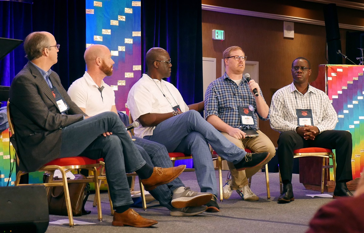 The Rev. Brian Atkins (second from right) speaks about the plans on offer from the Commission on Way Forward during the For Everyone Born gathering in St. Louis. Fellow commission members (from left) Dave Nuckols, Matt Berryman and Scott Johnson (furthest right) spoke about their work. Randall Miller (center) moderated the conversation. Photo by Heather Hahn, UMNS The Rev. Brian Atkins (second from right) speaks about the plans on offer from the Commission on Way Forward during the For Everyone Born gathering in St. Louis. Fellow commission members (from left) Dave Nuckols, Matt Berryman and Scott Johnson (furthest right) spoke about their work. Randall Miller (center) moderated the conversation. Photo by Heather Hahn, UMNS