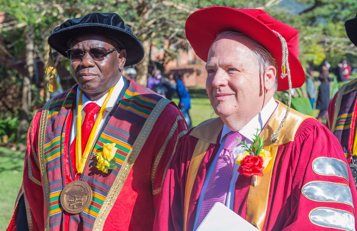 Munashe Furusa, vice chancellor of Africa University, and Timothy Keating process at Africa University where Keating spoke during commencement and received an honorary degree.  Photo courtesy of Africa University. 