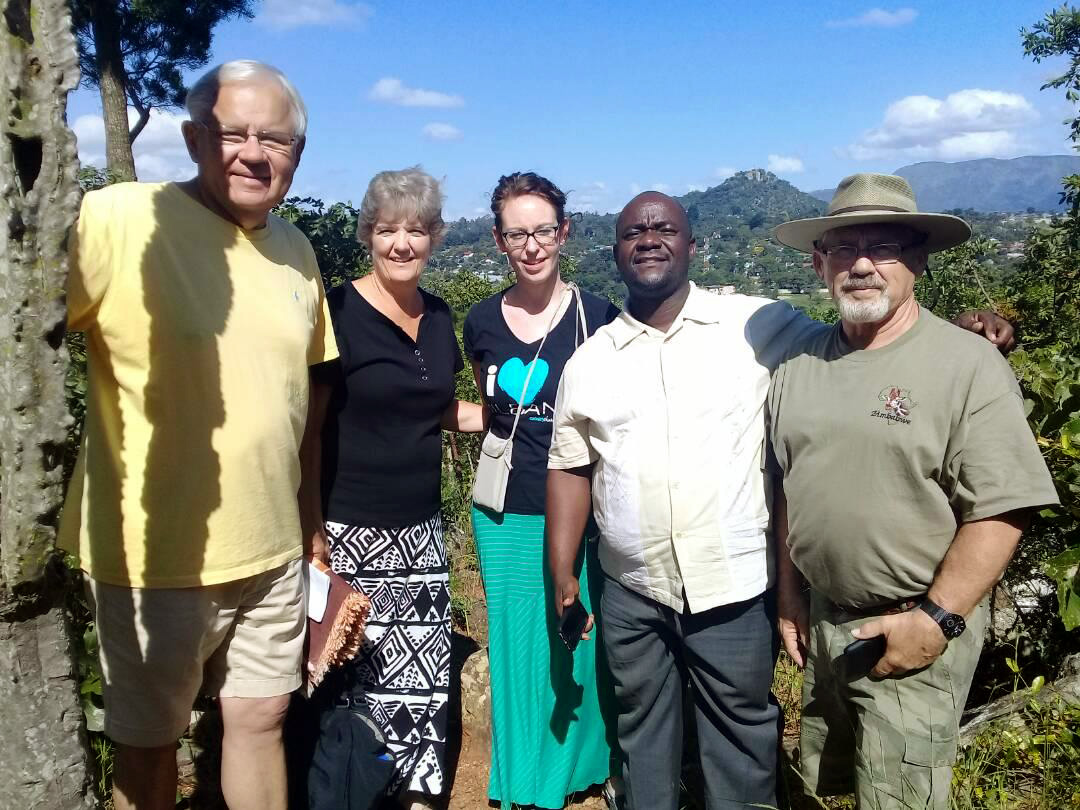 Arvid, Janet and Pamela Liebe (left) pose for a photo with the Rev. Lloyd Marange, and Bob Pudwill (right) at Mutambara Mission in Mutare, Zimbabwe. Arvid and Janet Liebe, from Central United Methodist Church in Millbank, South Dakota, have helped revitalize the farm, hospital and school at the mission. Photo courtesy of Mutambara Mission.