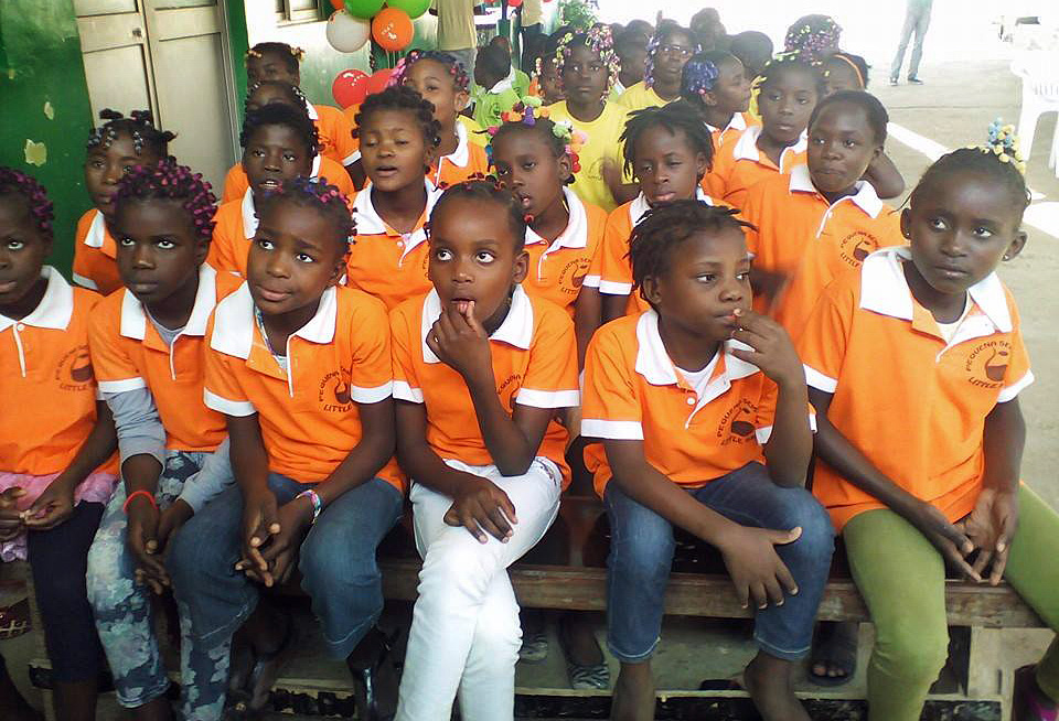 Children from the Little Seed Center orphanage in Cacuaco, Angola, gather to celebrate donations of food and other goods provided by young adults from Bethel United Methodist Church in Luanda. Photo by Paulo do Rosario.