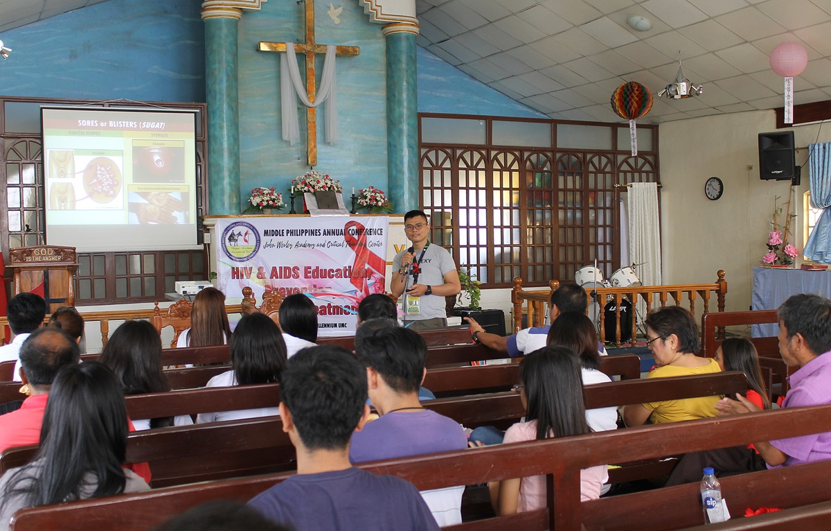 Public health official Adolfo "Trio" Paras III leads a class on AIDS prevention at Wesleyan Third Millennium United Methodist Church in Cabanatuan City, Philippines. Photo by Gladys Mangiduyos, UMNS.
