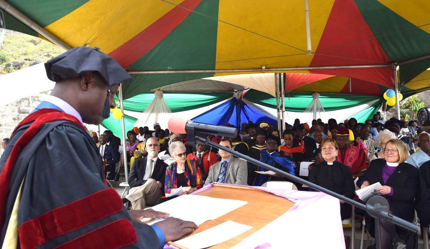 Bishop John Yambasu delivers his maiden speech as chancellor of United Methodist University in Sierra Leone at the launching and dedication service of the university on Jan. 27. Seated in the front row are the Rev. Kim Cape and Bishop Rosemarie Wenner. Photo by Phileas Jusu, UMNS.