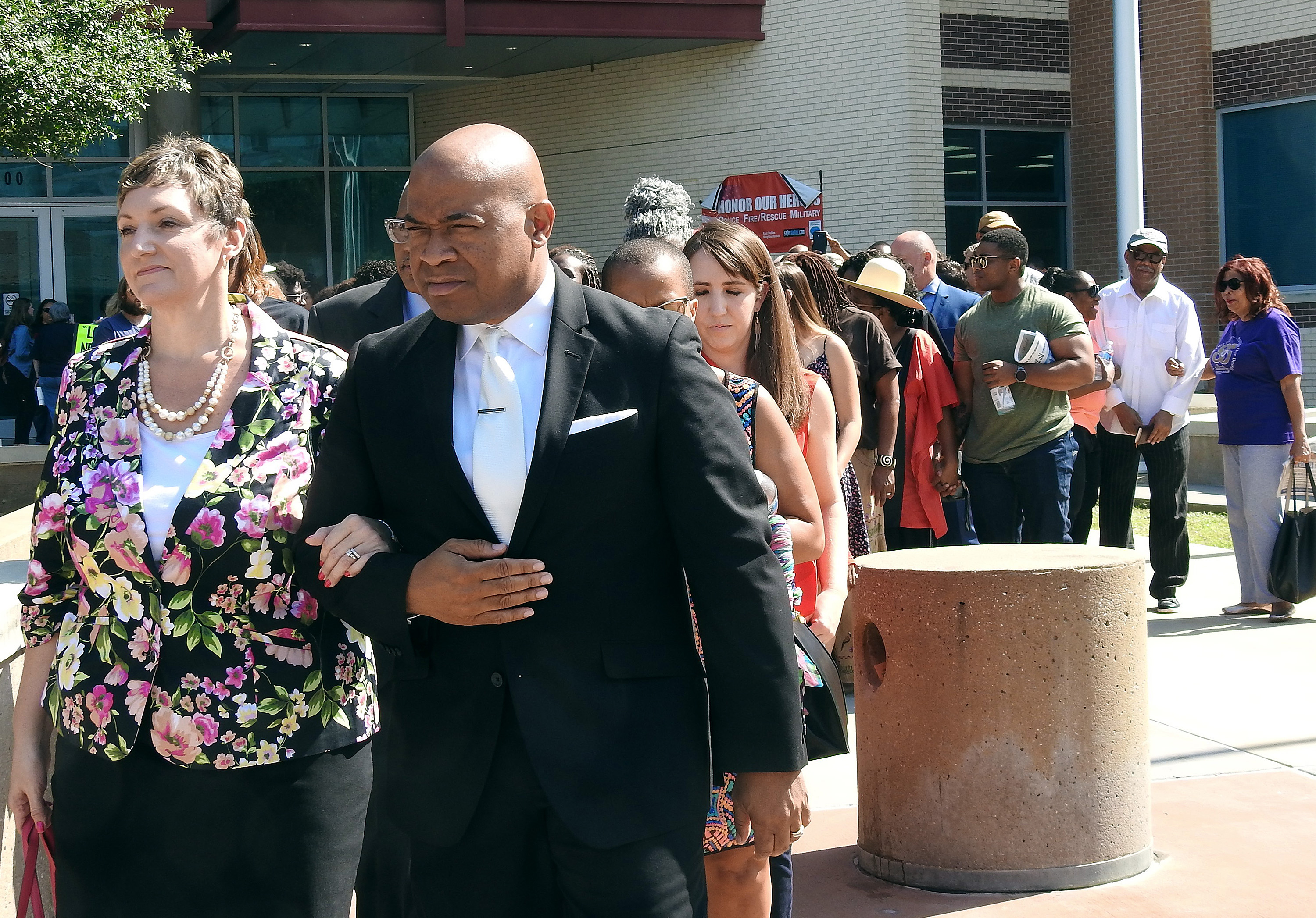 The Rev. Abril Goforth (left) and the Rev. Edlen Cowley lead a march of United Methodists from Dallas police headquarters to the apartment complex where a white officer shot and killed a black man in his residence. The group called for justice for 26-year-old victim Botham Jean. Photo by Sam Hodges, UMNS.