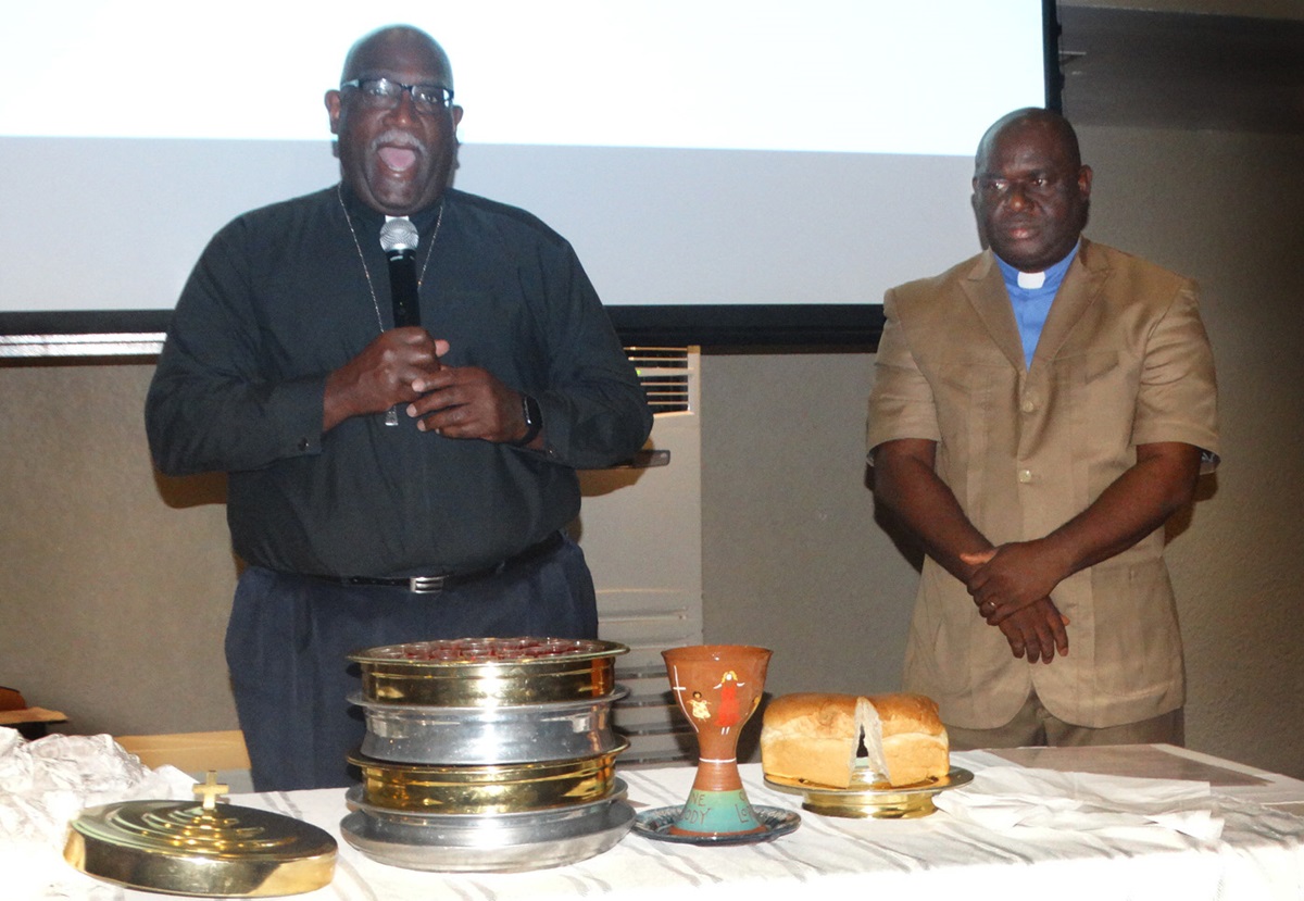 Bishop Gregory V. Palmer (left) of the Ohio West Area and the Rev. James Boye-Caulker of Sierra Leone bless the elements of Holy Communion during closing worship for the Africa Comprehensive Plan meeting in Freetown, Sierra Leone. Photo by Phileas Jusu, UMNS. Bishop Gregory V. Palmer (left) of the Ohio West Area and the Rev. James Boye-Caulker of Sierra Leone bless the elements of Holy Communion during closing worship for the Africa Comprehensive Plan meeting in Freetown, Sierra Leone. Photo by Phileas Jusu, UMNS.