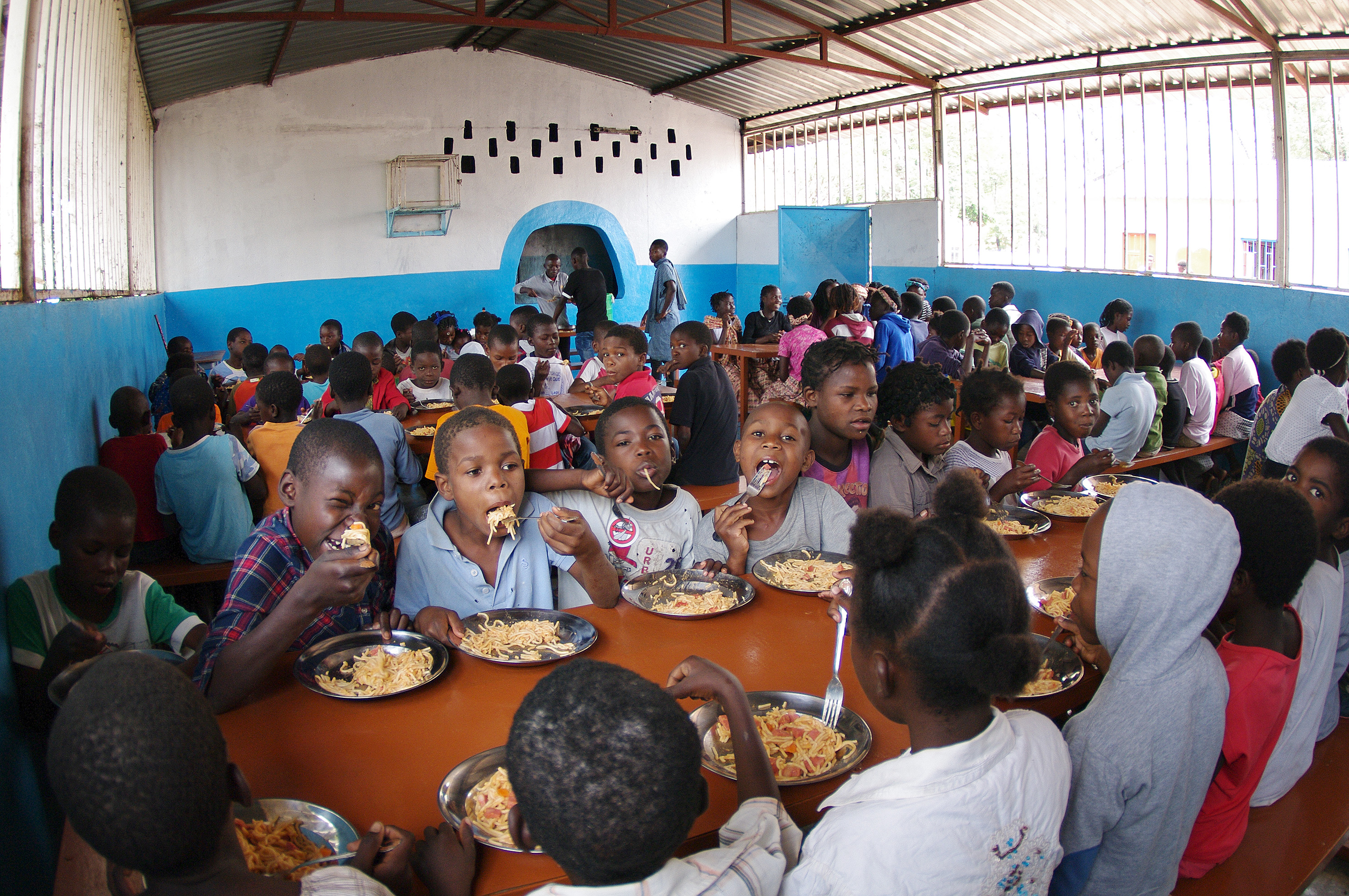Some 500 children enjoy a weekly lunch following Sunday worship at Central United Methodist Church in Quessua, Angola. Photo by the Rev. Gustavo Vasquez, UMNS.