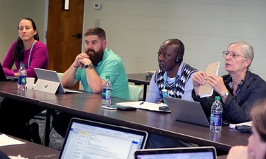 The Rules Committee of the Commission on General Conference discusses plans for one legislative committee at the 2019 special session. From left are Stephanie Henry, chair of the Rules Committee; commission members Audun Westad and Stanislas Kassongo, and translator Isabelle Berger. The commission met Oct. Oct. 3-5 at Epworth by the Sea in St. Simons, Ga. Photo by Heather Hahn, UMNS. The Rules Committee of the Commission on General Conference discusses plans for one legislative committee at the 2019 special session. From left are Stephanie Henry, chair of the Rules Committee; commission members Audun Westad and Stanislas Kassongo, and translator Isabelle Berger. The commission met Oct. Oct. 3-5 at Epworth by the Sea in St. Simons, Ga. Photo by Heather Hahn, UMNS.