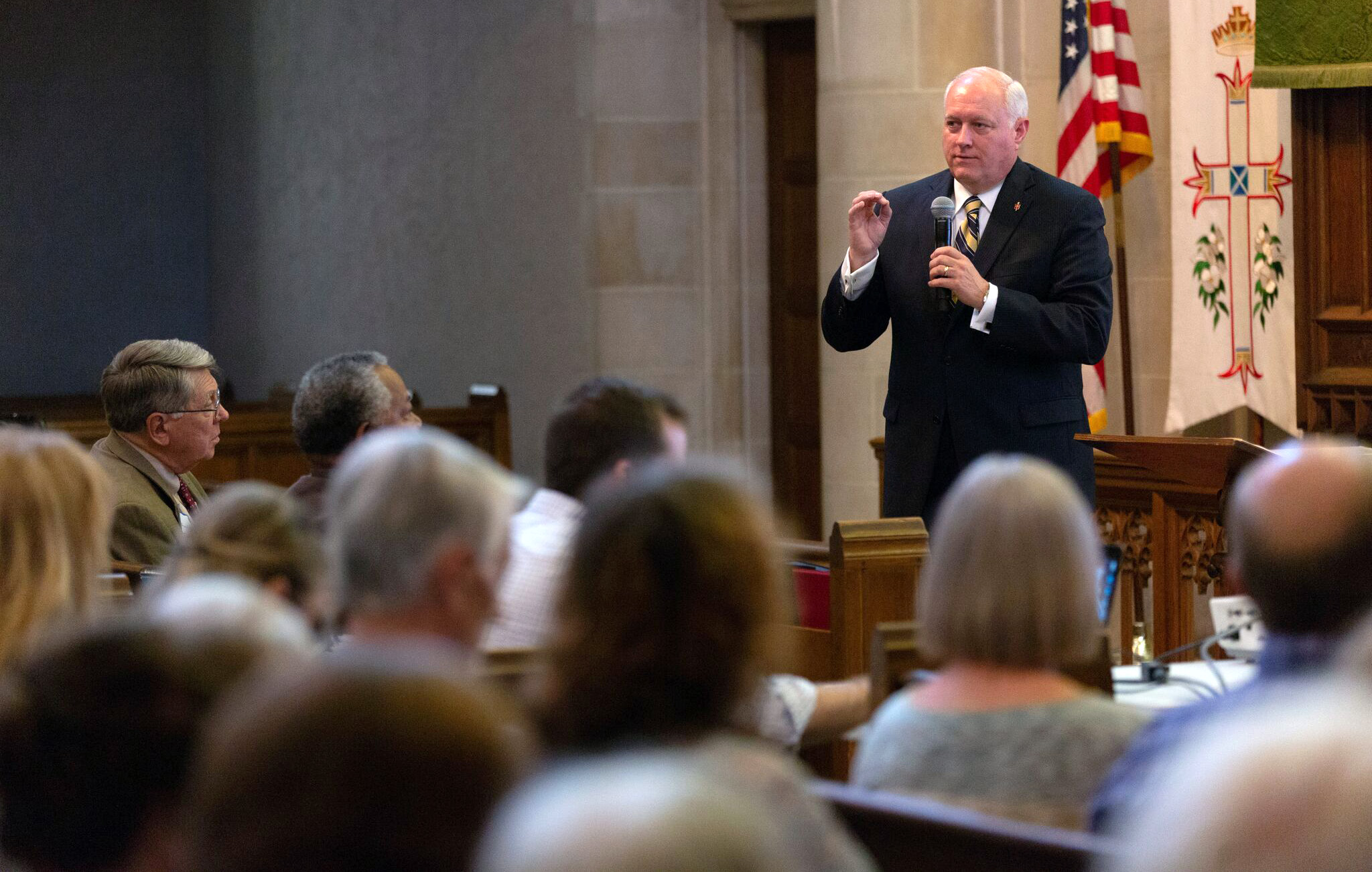 Alabama-West Florida Bishop David Graves answered questions in the packed sanctuary at First United Methodist Church in Montgomery, Ala. The gathering was one of many held in churches around the globe to hear the three main legislative options that emerged for special General Conference 2019. Photo by Luke Lucas, AWF Communications Specialist.