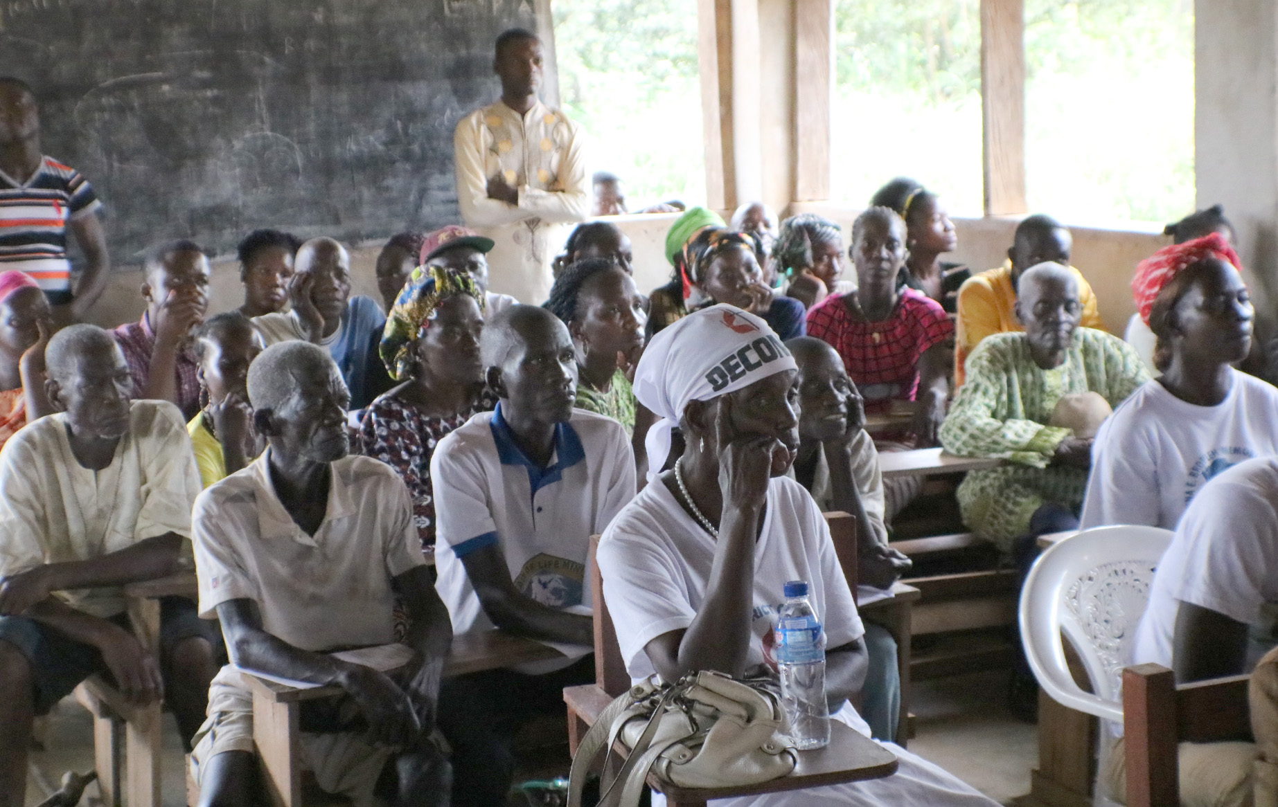 Parents attend a dedication ceremony for a new public school in the Tonglaywein Community in Nimba County, Liberia. Photo by E Julu Swen, UMNS.
