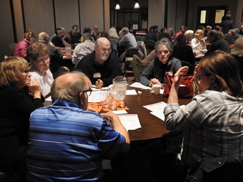 Minnesota Conference clergy and laity gathered at Normandale Hylands United Methodist Church hold table talk discussions about the three plans set to be considered by the special General Conference. Many United Methodist Conferences have been having town all meetings to explain the plans and give people a chance to share opinions about them. Photo by Sam Hodges, UMNS Minnesota Conference clergy and laity gathered at Normandale Hylands United Methodist Church hold table talk discussions about the three plans set to be considered by the special General Conference. Many United Methodist Conferences have been having town all meetings to explain the plans and give people a chance to share opinions about them. Photo by Sam Hodges, UMNS
