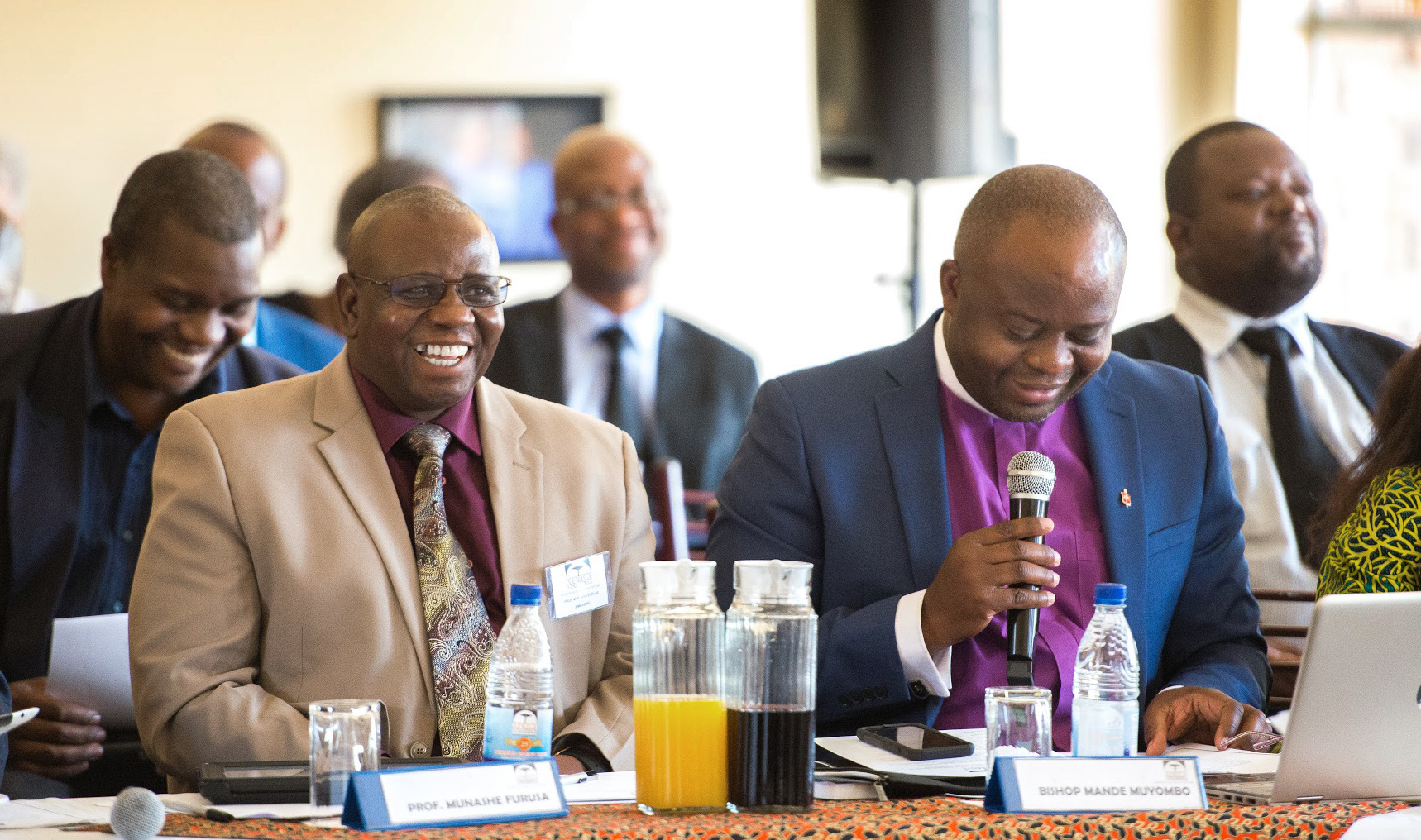 Bishop Mande Muyombo (front, right) presides over a meeting of the Africa University board of directors in Mutare, Zimbabwe. Mande is the first Africa University graduate to chair the board. Photo courtesy of Africa University. 
