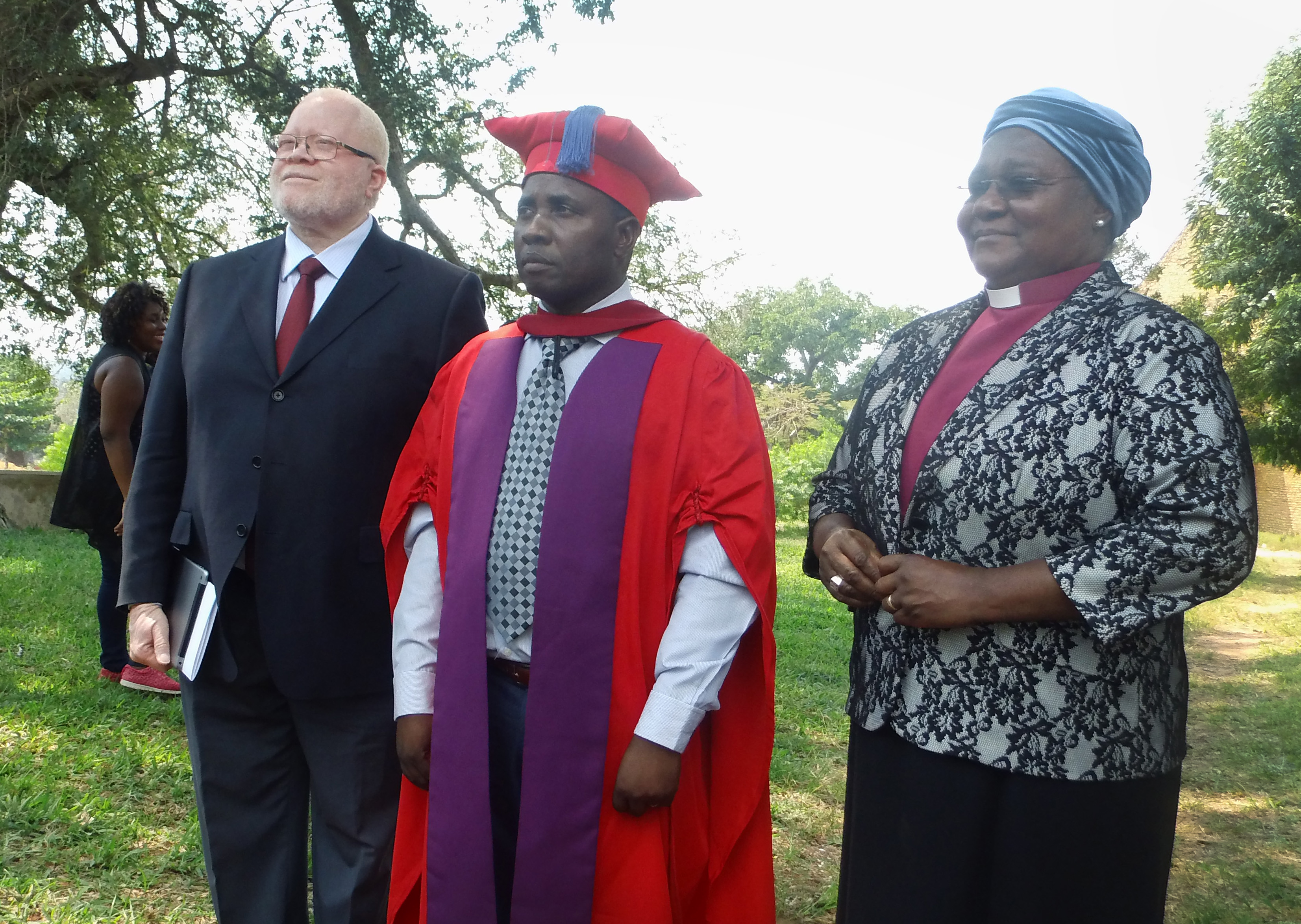 The Rev. Julio Andre Vilanculos, center, new vice chancellor of United Methodist University of Mozambique, is joined by Bishop Joaquina Filipe Nhanala and the Rev. Jamisse Taimo at an installation ceremony Sept. 20 in Morrumbene, Mozambique. Photo by Francisco Cumbe.