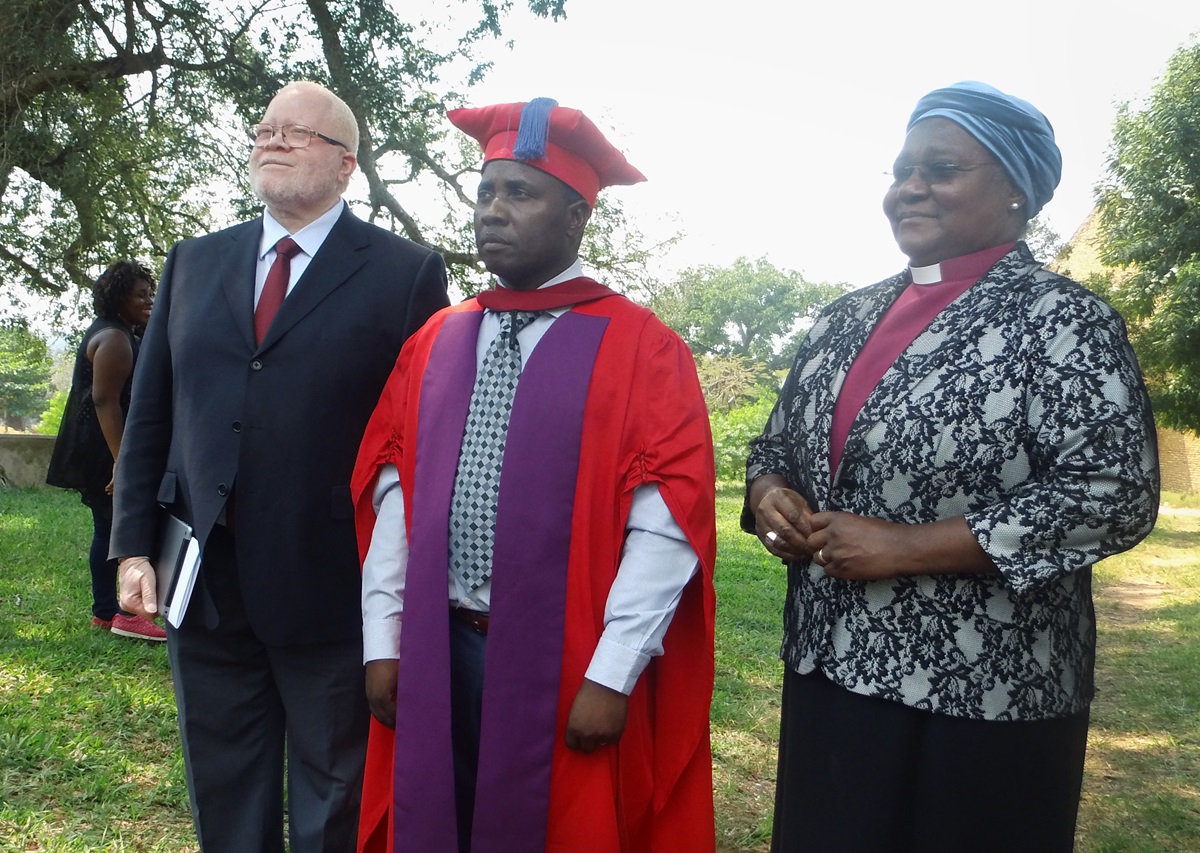 The Rev. Julio Andre Vilanculos, center, new vice chancellor of United Methodist University of Mozambique, is joined by Bishop Joaquina Filipe Nhanala and the Rev. Jamisse Taimo at an installation ceremony Sept. 20 in Morrumbene, Mozambique. Photo by Francisco Cumbe. The Rev. Julio Andre Vilanculos, center, new vice chancellor of United Methodist University of Mozambique, is joined by Bishop Joaquina Filipe Nhanala and the Rev. Jamisse Taimo at an installation ceremony Sept. 20 in Morrumbene, Mozambique. Photo by Francisco Cumbe.