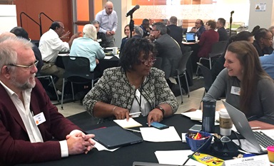Connectional Table members talk about ways to strengthen relationships across all levels of the denomination. Pictured from left are the Rev. Ole Birch of Denmark, Benedita Penicela-Nhambiu of Mozambique and Michelle Hettman of the Virginia Conference. Photo by Heather Hahn, UMNS. Connectional Table members talk about ways to strengthen relationships across all levels of the denomination. Pictured from left are the Rev. Ole Birch of Denmark, Benedita Penicela-Nhambiu of Mozambique and Michelle Hettman of the Virginia Conference. Photo by Heather Hahn, UMNS.
