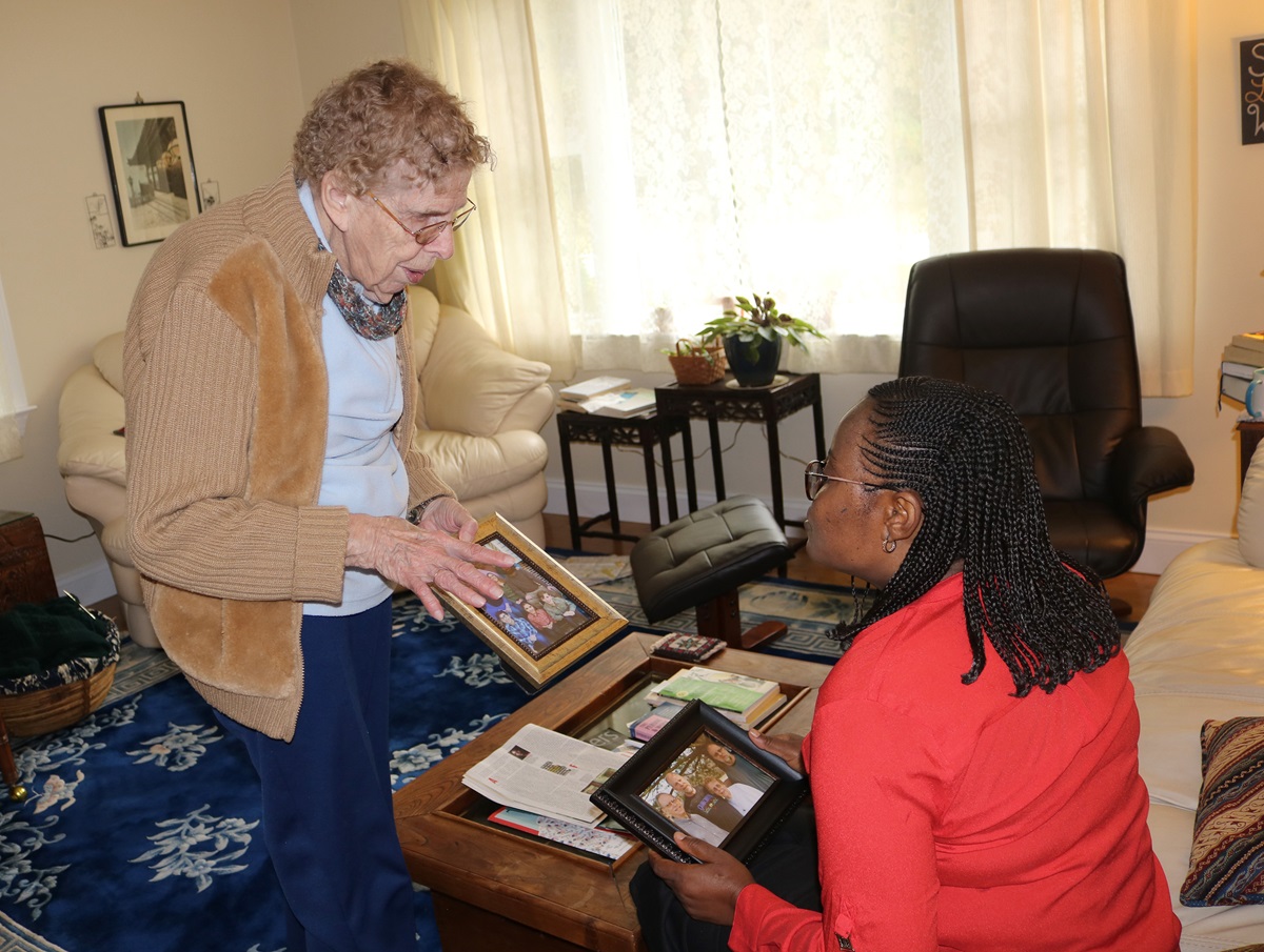 Dusty Knisley (left) of Calvary United Methodist Church in Dillsburg, Pa., shares her family story and photos with the Rev. Daisy Gbloh from Sierra Leone. Knisley hosted a team from the Sierra Leone Conference at her home. Photo by Phileas Jusu, UMNS. Dusty Knisley (left) of Calvary United Methodist Church in Dillsburg, Pa., shares her family story and photos with the Rev. Daisy Gbloh from Sierra Leone. Knisley hosted a team from the Sierra Leone Conference at her home. Photo by Phileas Jusu, UMNS.
