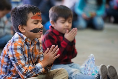 Children pray during a Christmas party at the Door of Hope Salvation Army shelter in Tijuana, Mexico. Migrant children who are staying with their mothers at the shelter joined with kids from the neighborhood and volunteers from the Methodist Church of Mexico in the celebration. Photo by Mike DuBose, UMNS. Children pray during a Christmas party at the Door of Hope Salvation Army shelter in Tijuana, Mexico. Migrant children who are staying with their mothers at the shelter joined with kids from the neighborhood and volunteers from the Methodist Church of Mexico in the celebration. Photo by Mike DuBose, UMNS.