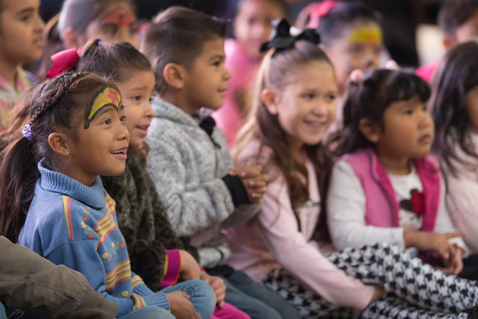 Children watch a skit during the Christmas party. Photo by Mike DuBose, UMNS.