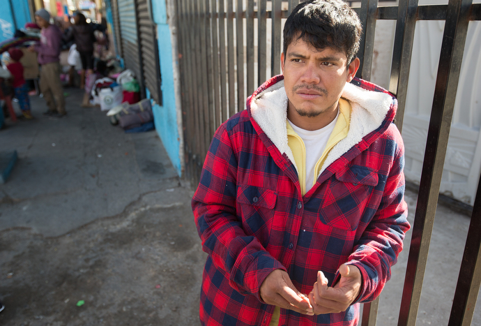 Jose Barrera describes his journey from El Salvador as he waits for a meal outside El Divino Redentor Methodist Church in Mexicali, Mexico. Local Methodist churches are helping provide food, hygiene kits and prayer support for the influx of mostly Central American migrants.