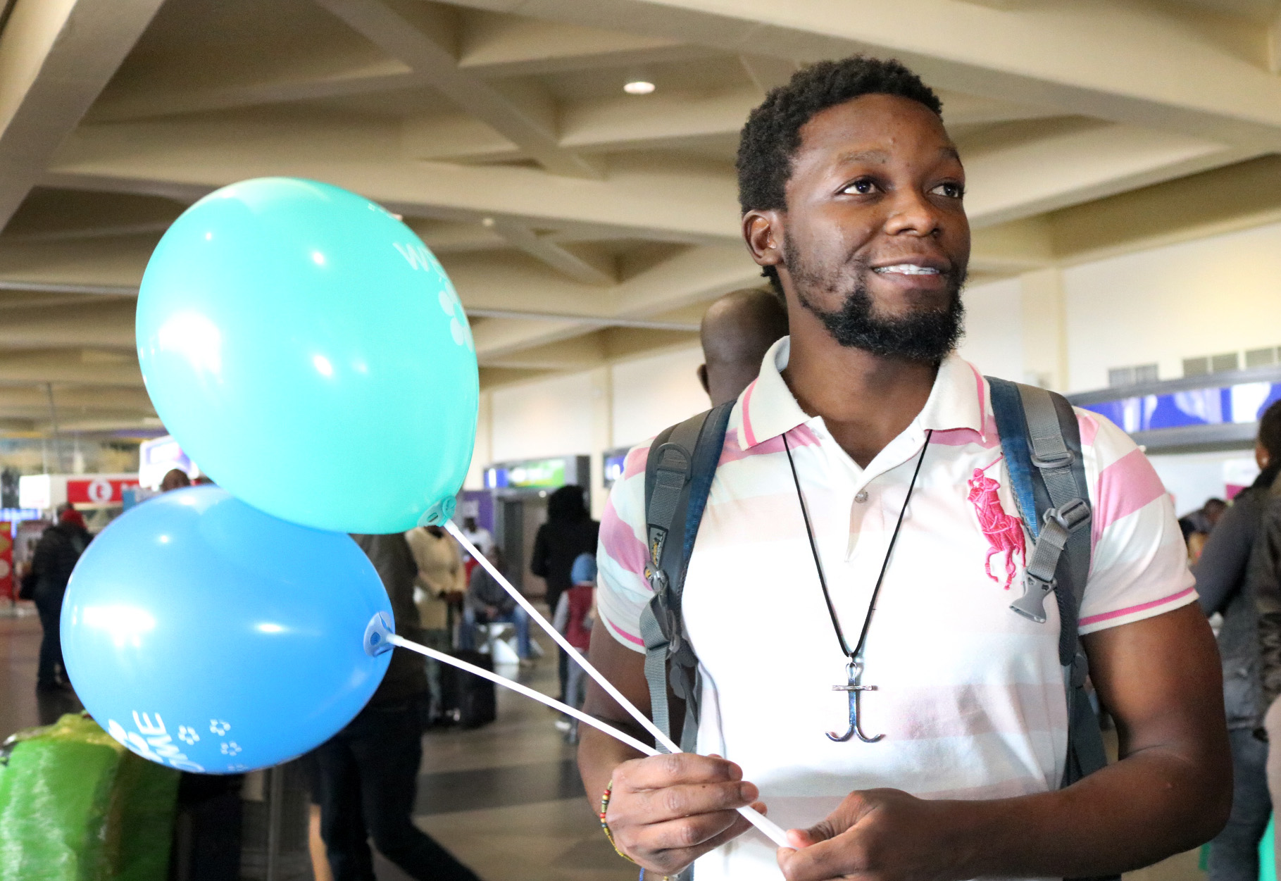 Tawanda Chandiwana exhibits a broad smile as he arrives home in Zimbabwe following a 56-day detention in the Philippines. Photo by Taurai Emmanuel Maforo, UMNS.