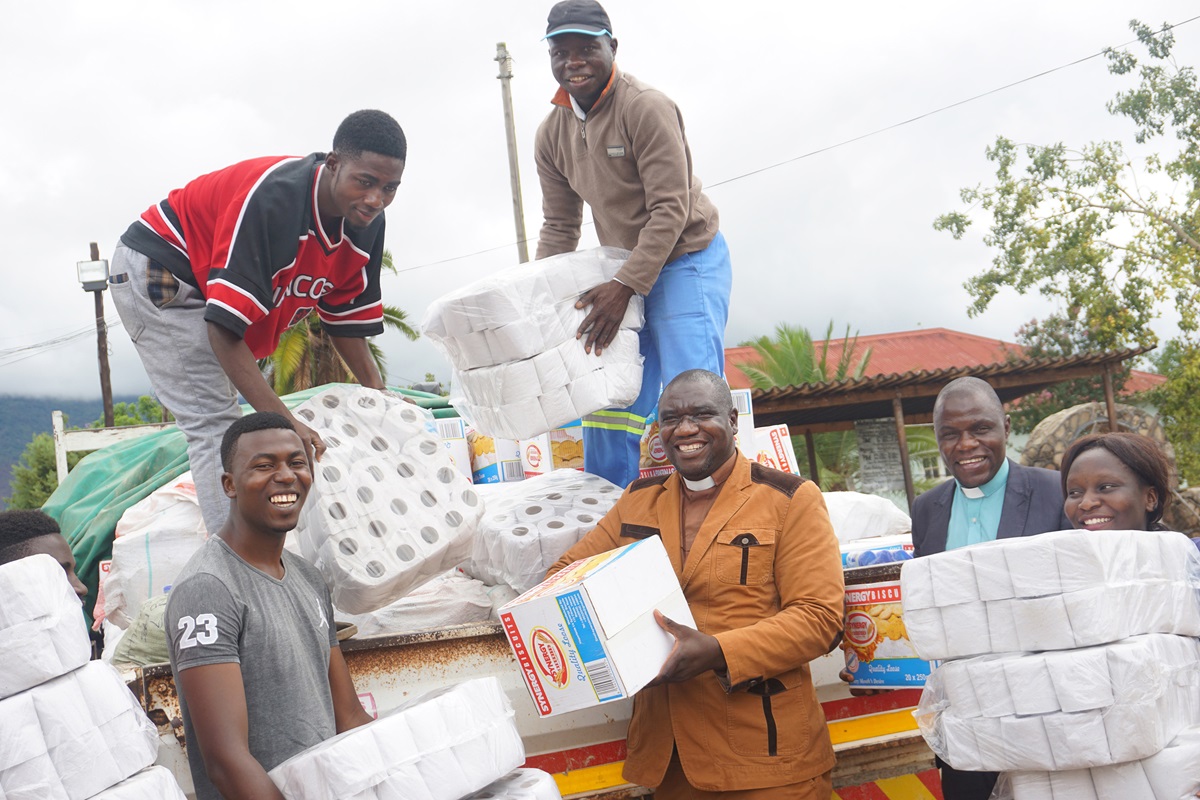 Clockwise from top center, Blessing Ngorima, Kumbirai Mambara, the Rev. Willard Karamba, the Rev. Togara Bobo, Shadreck Tanyaradzwa Majuru and Simbarashe Chandanakira deliver donations to Mutare Provisional Remand Prison in Zimbabwe. Photo by Kudzai Chingwe, UMNS.