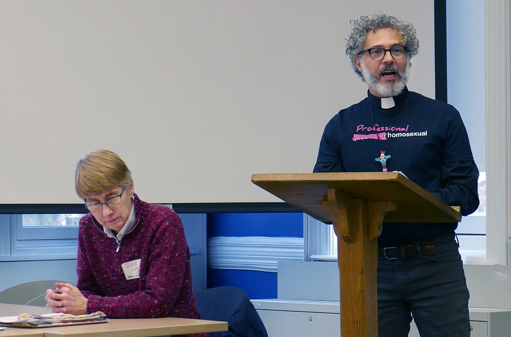The Rev. Alex da Silva Souto, pastor and co-convener of the unofficial United Methodist Queer Clergy Caucus, talks about the Simple Plan. Sue Laurie, a longtime activist for LGBTQ equality in the church, sits listening. Photo by Heather Hahn, UMNS.