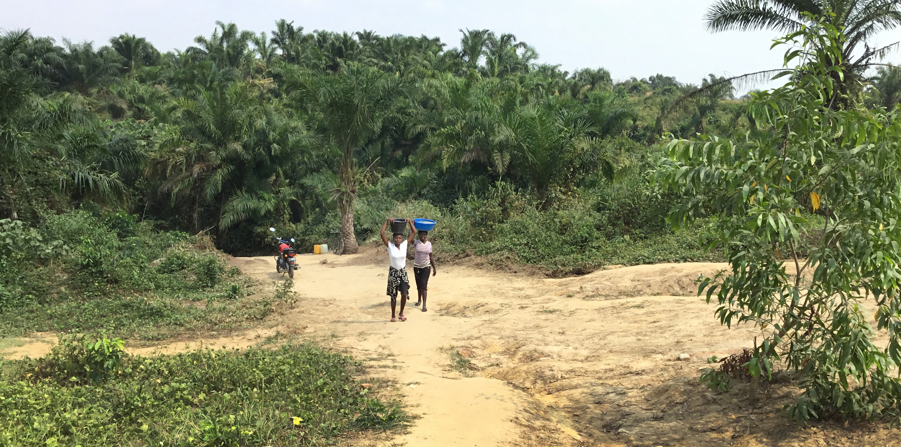 A long dirt road leads to a source for clean water in the East Congo. Photo by Judith Osongo Yanga