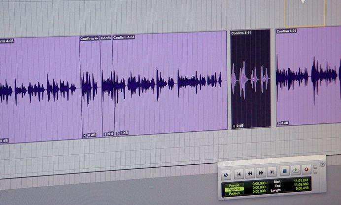 Audio waves are displayed in an editing program.  Audio waves are displayed in an editing program.