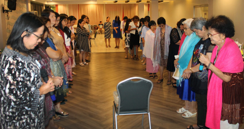 Deaconesses pray during the commitment time and dedication of gifts and pledges to sustain the deaconess program at Harris Memorial College in Taytay, Philippines. Photo by Gladys Mangiduyos, UMNS.