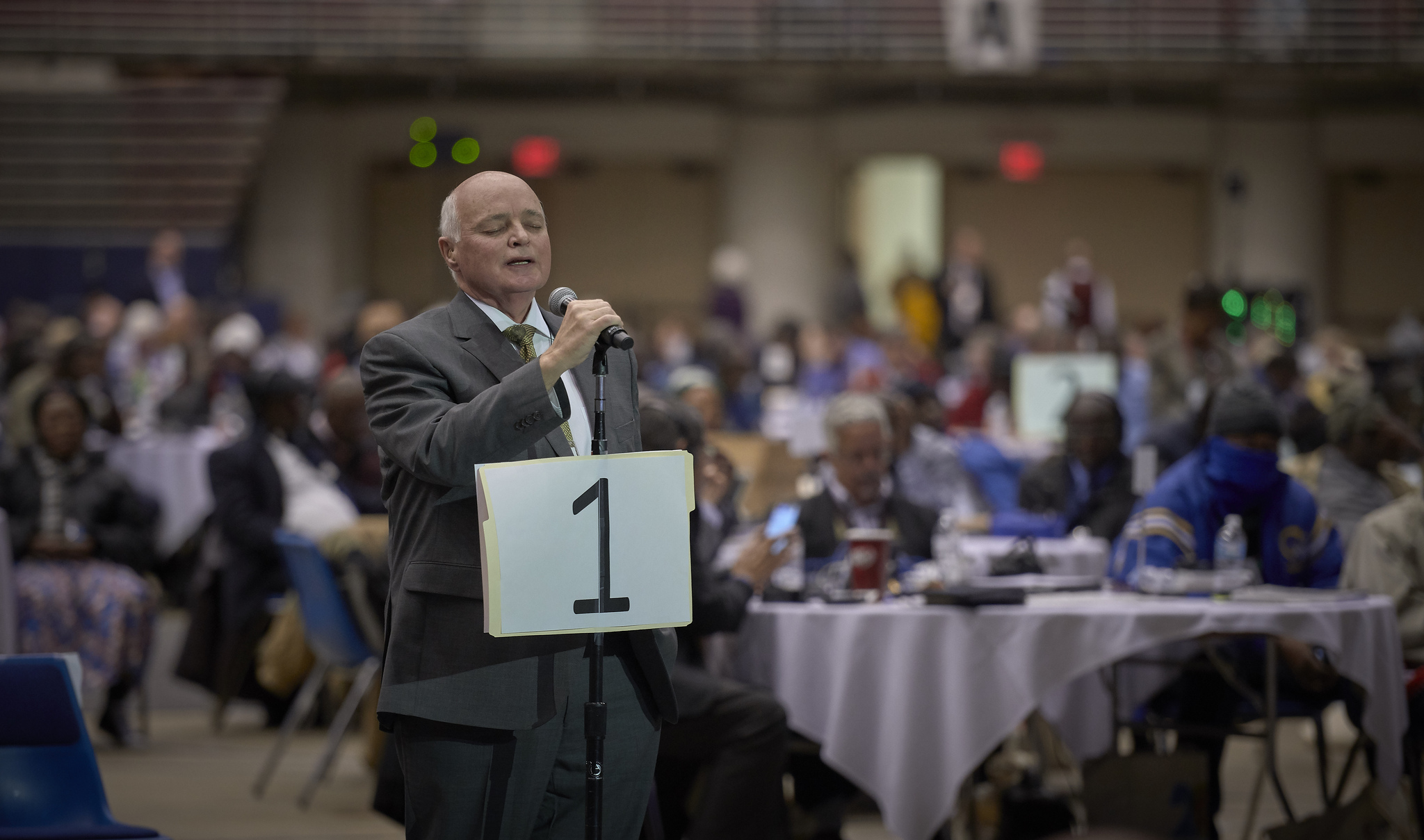 The Rev. Timothy McClendon of South Carolina leads delegates in prayer before a Feb. 26 vote approving the Traditional Plan, which maintains The United Methodist Church’s policies about homosexuality and strengthens enforcement. The vote came on the last day of the special General Conference in St. Louis. Photo by Paul Jeffrey, UMNS.