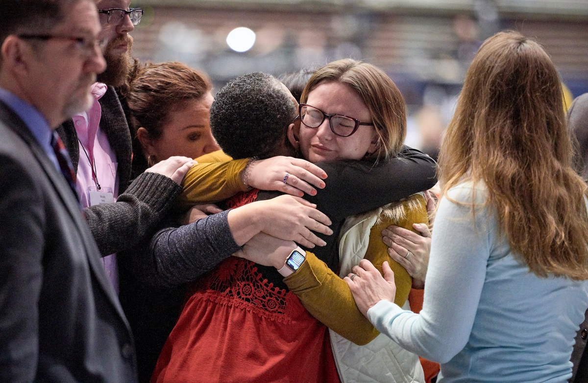 Delegate Shayla Jordan receives hugs after speaking in support of the One Church Plan during the 2019 United Methodist General Conference in St. Louis. Young United Methodists have differing views on whether the Traditional Plan, adopted by the special General Conference, is the best way forward for the denomination. Photo by Paul Jeffrey, UMNS. Delegate Shayla Jordan receives hugs after speaking in support of the One Church Plan during the 2019 United Methodist General Conference in St. Louis. Young United Methodists have differing views on whether the Traditional Plan, adopted by the special General Conference, is the best way forward for the denomination. Photo by Paul Jeffrey, UMNS.