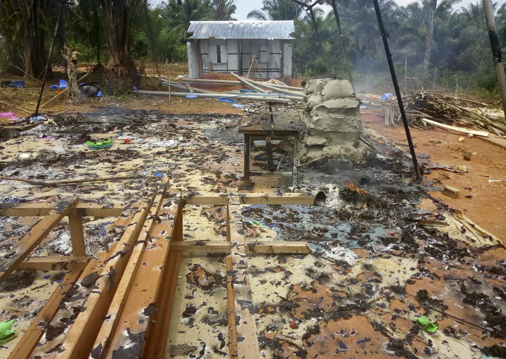 A fire smolders at a former Ebola treatment center in the Munguredjipa Health Zone west of Butembo, Congo. Photo by Justine Tchongo, UMNS. 