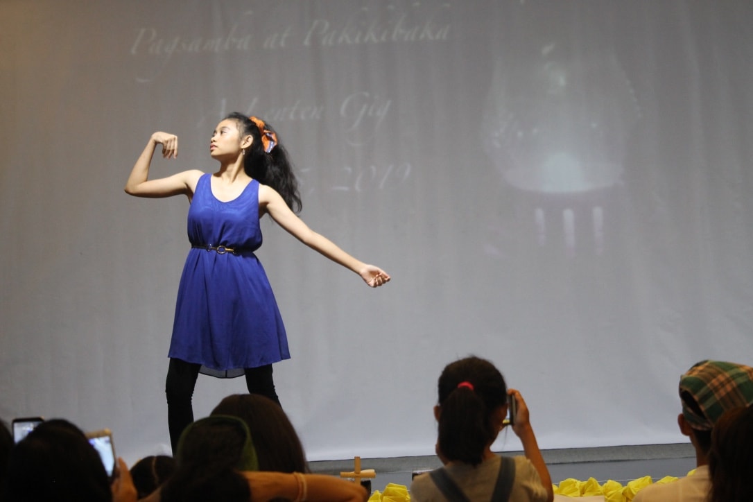 Clellandley Bueno, a student from Wesleyan University-Philippines, performs a dance during a Lenten event in Cabanatuan City, Philippines. The gathering was hosted by John Wesley Academy and Critical Thinking Center to decry the killings of 14 farmers in the Negros Oriental province. Photo by Gladys Mangiduoys, UMNS.