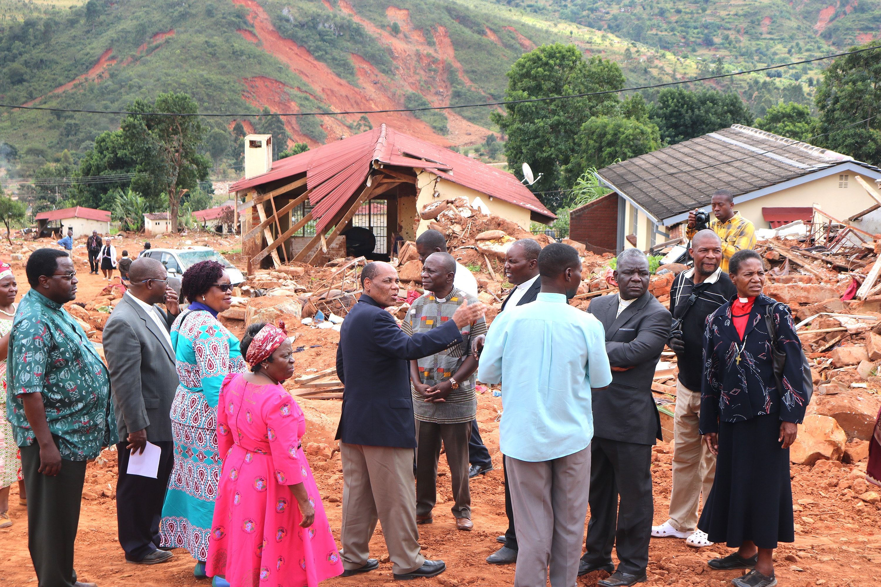 Bishop Eben K. Nhiwatiwa and other United Methodist church leaders tour Ngangu, Zimbabwe, an area hard hit by Cyclone Idai in March. Photo by Priscilla Muzerengwa, UMNS.