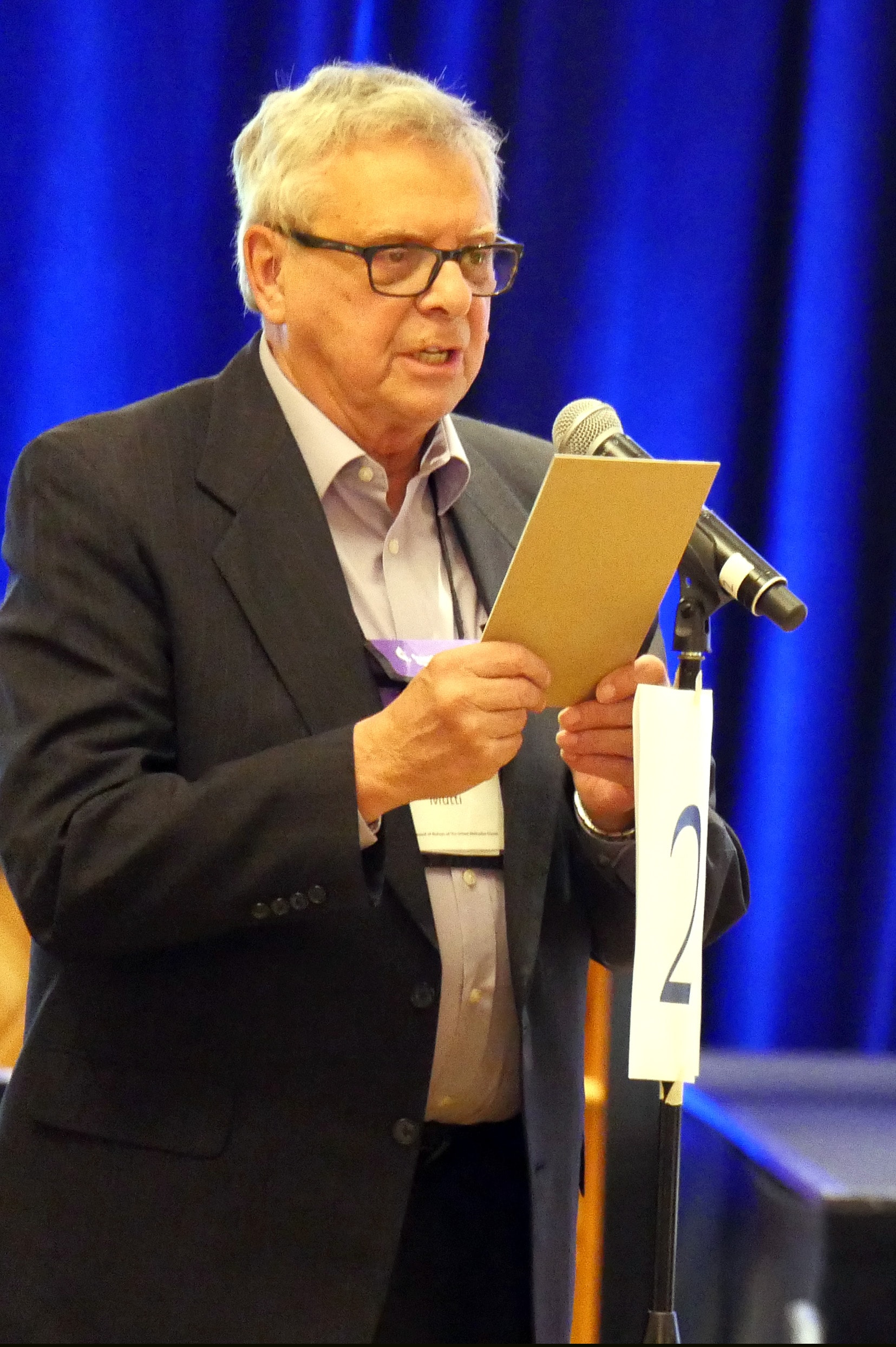 Retired Bishop Albert Frederick “Fritz” Mutti III speaks to the Council of Bishops about his late sons, Tim and Fred, and why he feels called to speak in support of LGBTQ people. Photo by Heather Hahn, UMNS.
