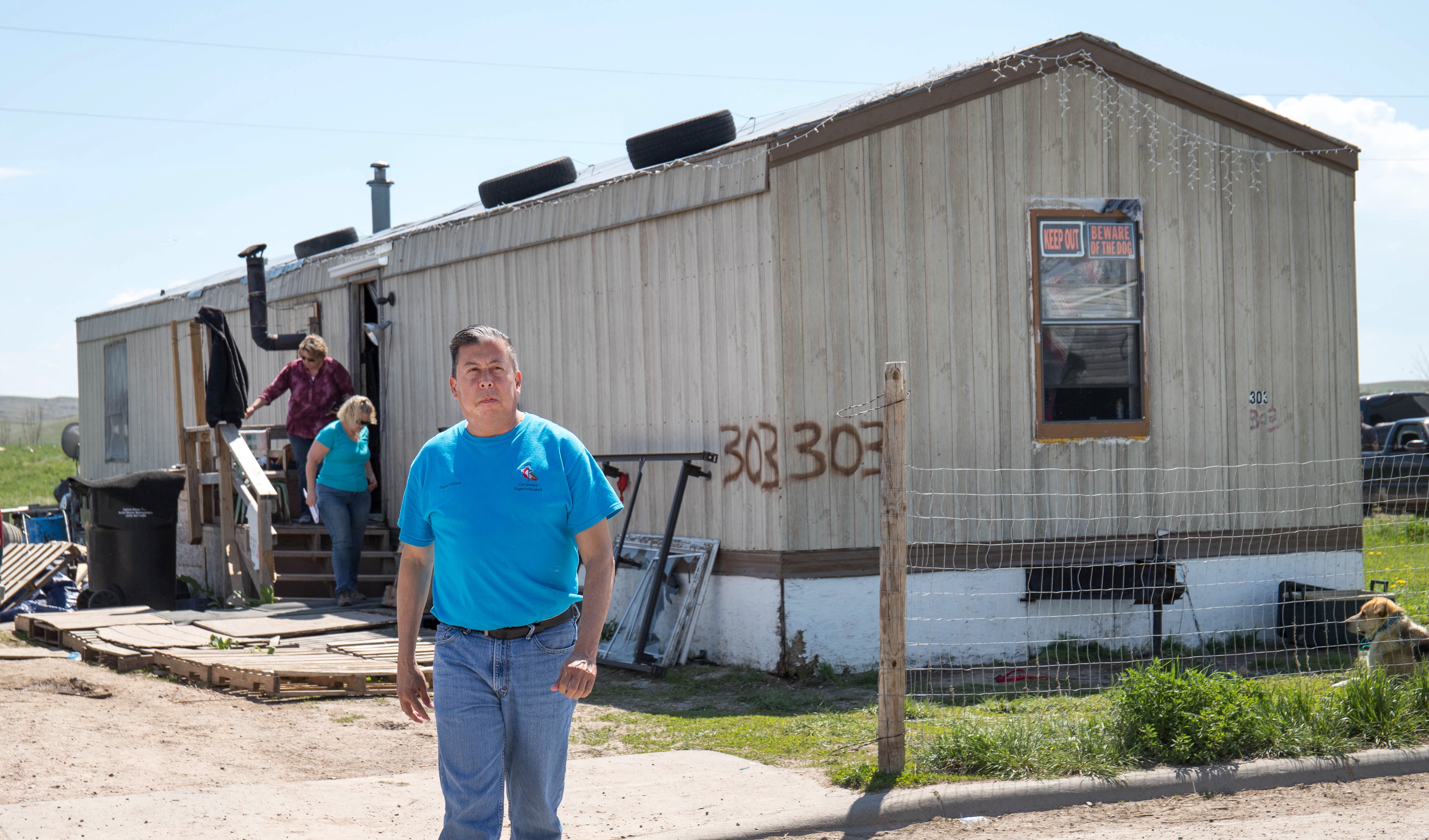 The Rev. David Wilson from the Oklahoma Indian Missionary Conference visits a home damaged by two recent snowstorms and subsequent flooding on the Pine Ridge Indian Reservation in South Dakota. Photo by Ginny Underwood, UM News. 