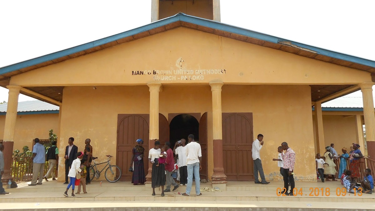 Parishioners gather outside Mango Brown United Methodist Church in the Pa Loko community near Freetown, Sierra Leone, in February 2018. Three members of the church were injured Sunday in a violent attack on their nearby home. File photo by LaDonna Weiler, Faith Church. Parishioners gather outside Mango Brown United Methodist Church in the Pa Loko community near Freetown, Sierra Leone, in February 2018. Three members of the church were injured Sunday in a violent attack on their nearby home. File photo by LaDonna Weiler, Faith Church.