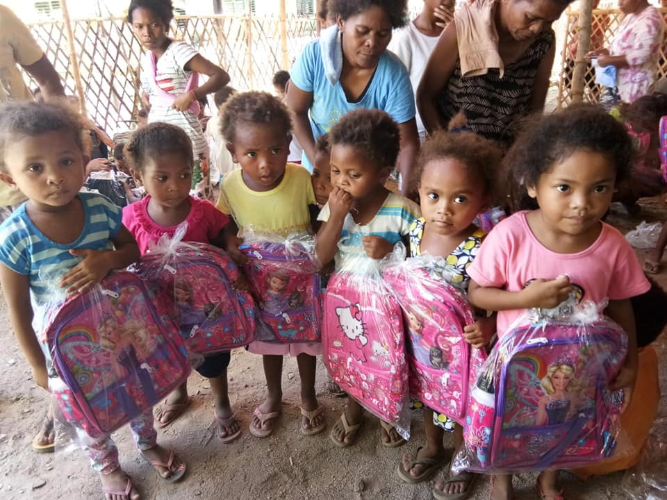 Children from Camachile Elementary School in the Philippines receive the school bags from Camachile United Methodist Church and God's Helping and Healing Hands Ministry. Photo courtesy of the Rev. Leslie C. Dela Cruz.