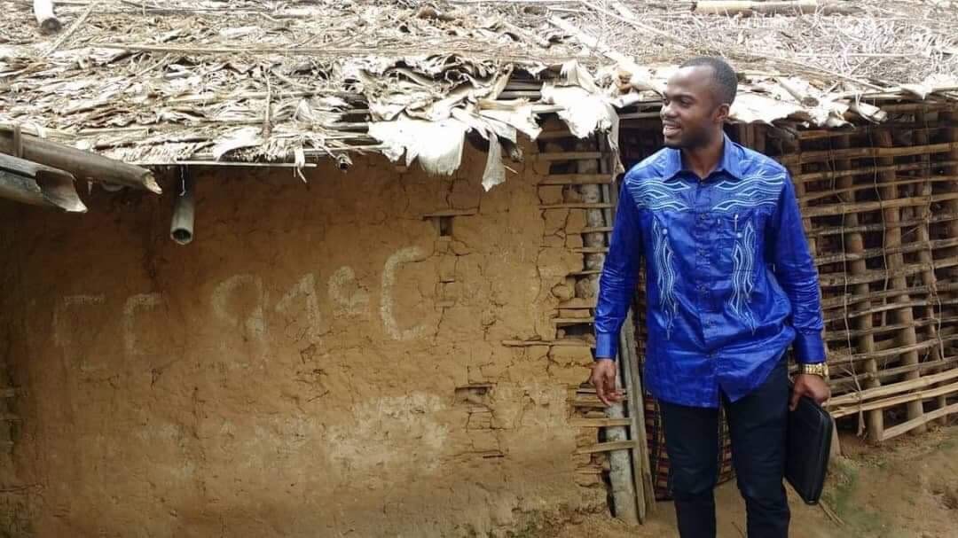 Dr. Damas Lushima stands outside the former Osio Health Center. Lushima served as the general coordinator of the new center. Photo courtesy of the Equator and Oriental Annual Conference.