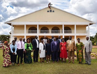 The Zimbabwe Episcopal delegation stand in front of Joli Site Church in Galilee during their visit in the South Congo Episcopal Area. Photo by Chenayi Kumuterera, UM News.  The Zimbabwe Episcopal delegation stand in front of Joli Site Church in Galilee during their visit in the South Congo Episcopal Area. Photo by Chenayi Kumuterera, UM News.