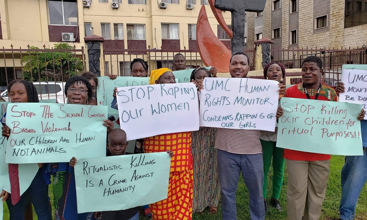 Protesters hold placards protesting violence against women and children. They are standing outside The United Methodist Church Central Office in Monrovia, Liberia. Photo by E Julu Swen, UM News.  Protesters hold placards protesting violence against women and children. They are standing outside The United Methodist Church Central Office in Monrovia, Liberia. Photo by E Julu Swen, UM News.