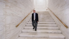The Rev. Jeff Allen walks through the West Virginia State Capitol in Charleston. Allen, executive director of the West Virginia Council of Churches, says it's important for the faith community to be heard in matters of public policy. Photo by Mike DuBose, UM News.