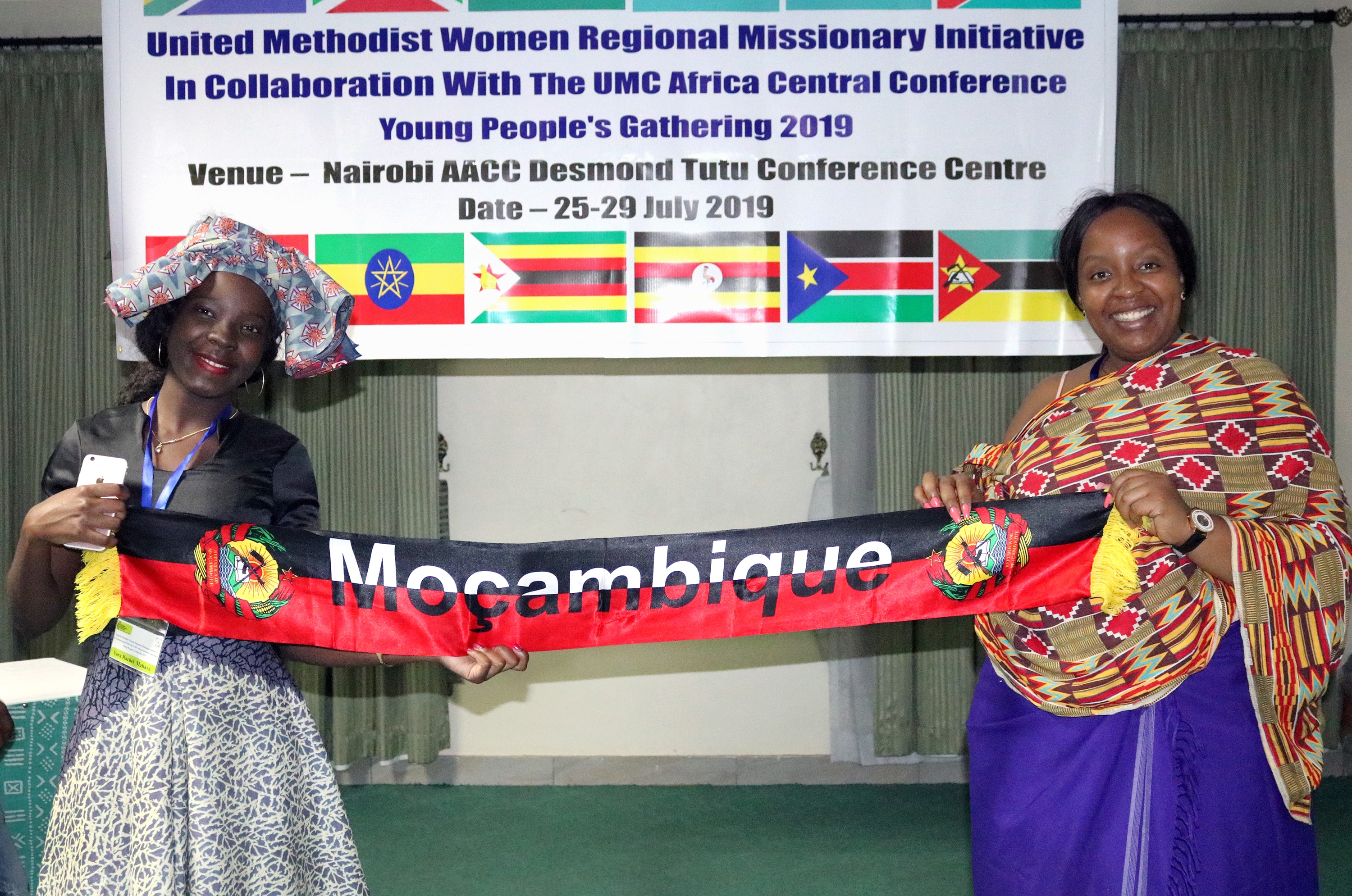 Two young women from Mozambique showcase their traditional attire during the Africa Youth and Young Adult Network gathering in Nairobi, Kenya. Young United Methodists from across the African continent gathered at the Desmond Tutu Conference Centre under the theme “Arise and Shine.” Photo by Gad Maiga, UM News.