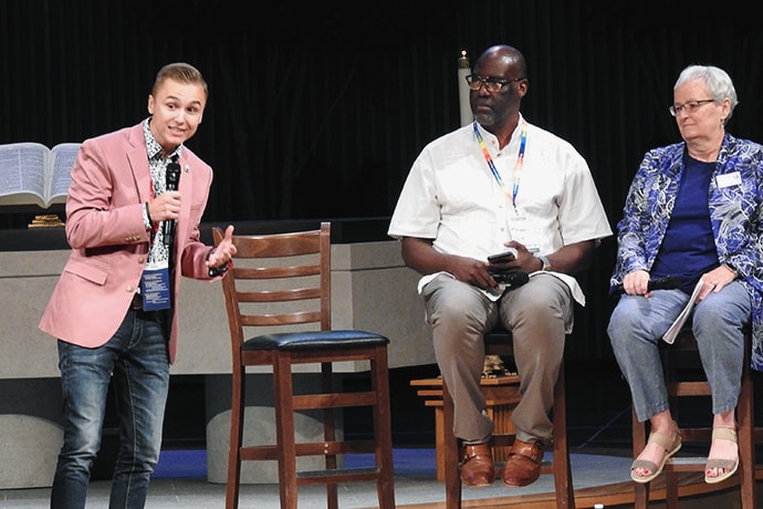J.J. Warren speaks at the Sept. 25-27 Leadership Institute, held at the United Methodist Church of the Resurrection in Leawood, Kansas. Warren is an openly gay man who spoke at General Conference 2019 of his evangelism work LGBTQ college students. Joining him for a panel on LGBTQ inclusion in The United Methodist Church were Randall Miller and Jan Lawrence of Reconciling Ministries Network. Photo by Sam Hodges, UM News.
