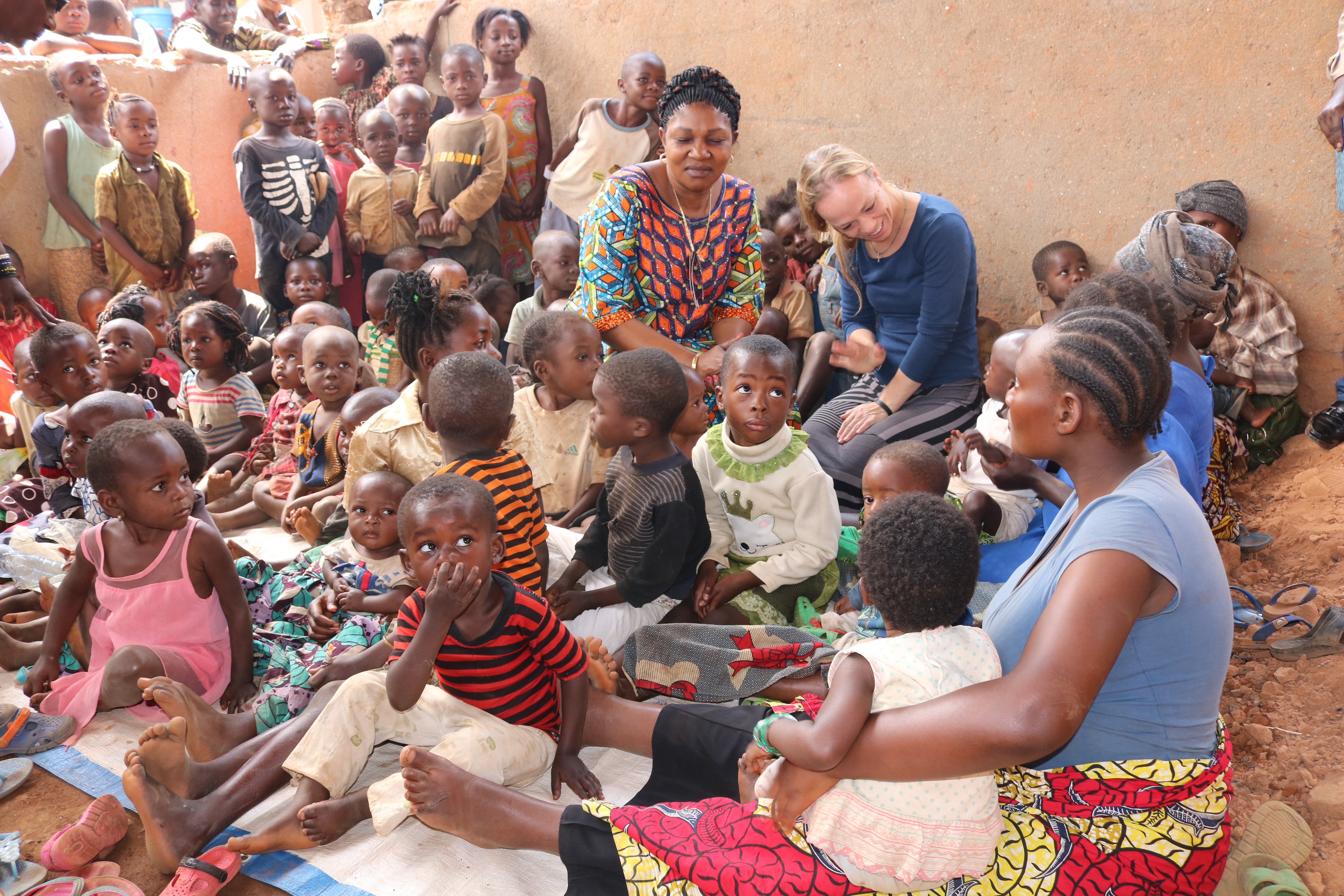 Megan Klingler, who works with the United Methodist Board of Global Ministries’ Global Health unit, and Dr. Marie Claire Manafundu, program officer of the Maternal and Child Health Program in Eastern Congo, visit with children at Irambo Hospital in Bukavu. Klingler visited six cities in the country during a three-week trip to conduct training sessions to help stop the spread of Ebola. Photo by Philippe Kituka Lolonga, UM News.