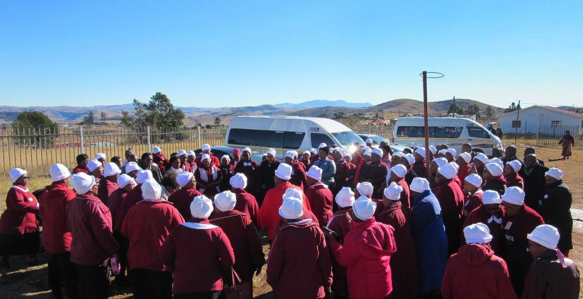 United Methodist women in the South Africa Conference pray outside a United Methodist church in Durban. The prayer circle was part of a church-wide day of prayer to end xenophobia in the country. Photo by Nandipha Mkwalo, UM News.