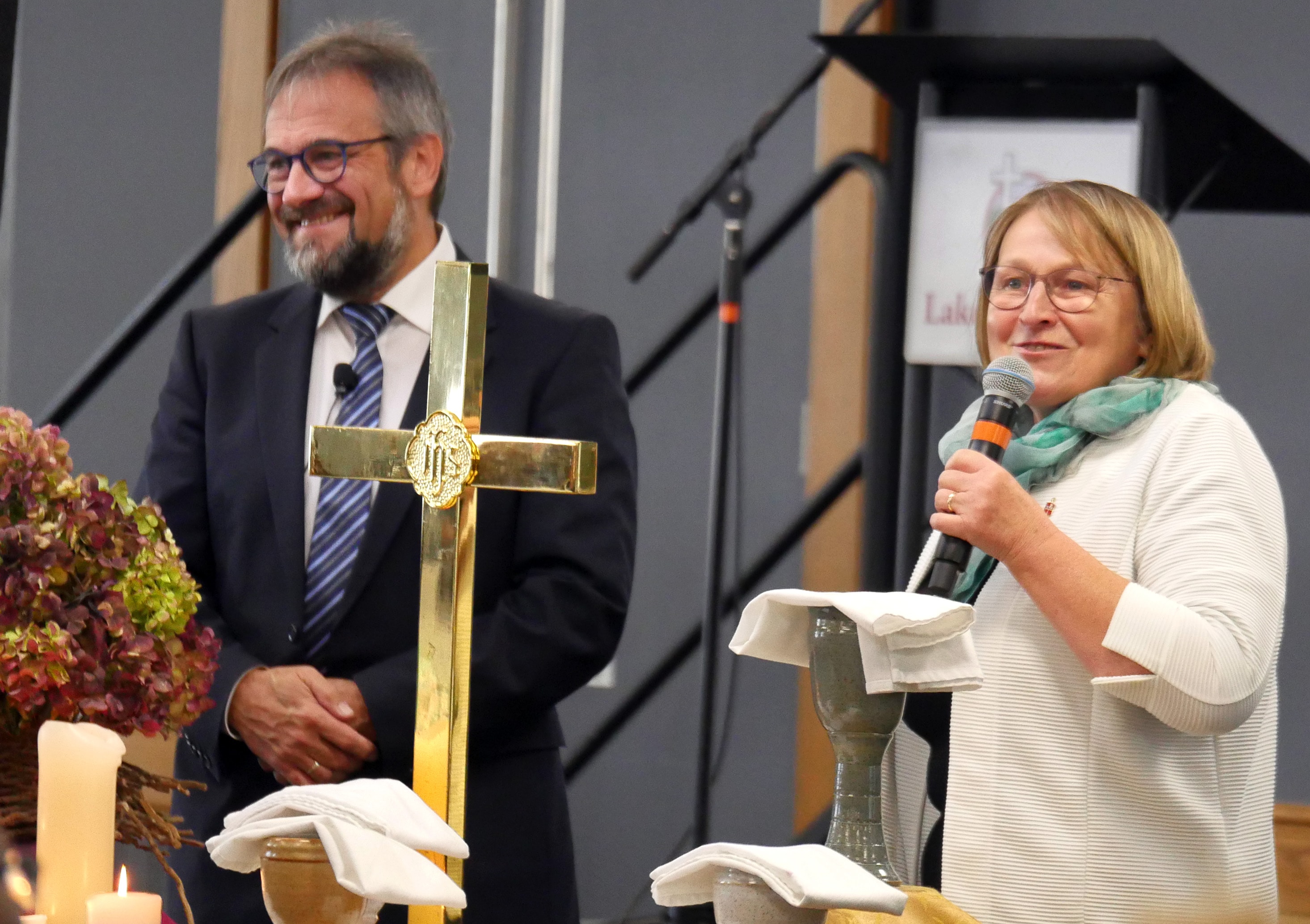 Bishops Harald Rückert and Rosemarie Wenner of Germany recount the role the Christian faith played in the fall of the Berlin Wall 30 years ago. During the Council of Bishops meeting in Lake Junaluska, N.C., bishops were challenged to remove barriers of various kinds. Photo by Heather Hahn, UM News.