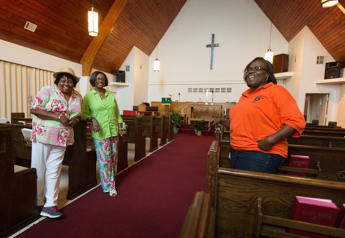 Church members show the restored sanctuary at Hartzell United Methodist Church in New Orleans' Lower 9th Ward. The sanctuary was flooded by Hurricane Katrina in 2005. From left are: Burnetta D. Fauria, Angelique White Williams and Andrea Sanchez-Reese. Photo by Mike DuBose, UMNS. Church members show the restored sanctuary at Hartzell United Methodist Church in New Orleans' Lower 9th Ward. The sanctuary was flooded by Hurricane Katrina in 2005. From left are: Burnetta D. Fauria, Angelique White Williams and Andrea Sanchez-Reese. Photo by Mike DuBose, UMNS.