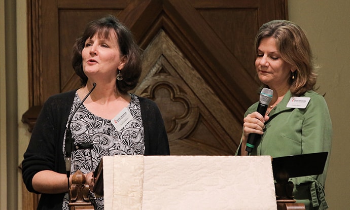Karen Distefano, left, mission interpreter for the Encounter with Christ fund, and the Rev. Cynthia Weems, who heads the fund’s advisory committee, speak about the fund’s history and accomplishments during the Oct. 10 opening worship of the Global Ministries’ board of directors fall meeting in Atlanta. Photo by Anthony Trueheart, Global Ministries.