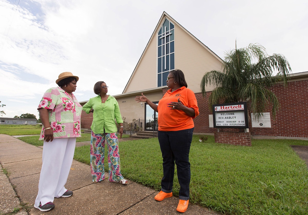 Church members discuss the progress of recovery in the area around Hartzell United Methodist Church in New Orleans' Lower 9th Ward, which was flooded by Hurricane Katrina in 2005. From left are Burnetta D. Fauria, Angelique White-Williams and Andrea Sanchez-Reese. Photo by Mike DuBose, UMNS. Church members discuss the progress of recovery in the area around Hartzell United Methodist Church in New Orleans' Lower 9th Ward, which was flooded by Hurricane Katrina in 2005. From left are Burnetta D. Fauria, Angelique White-Williams and Andrea Sanchez-Reese. Photo by Mike DuBose, UMNS.